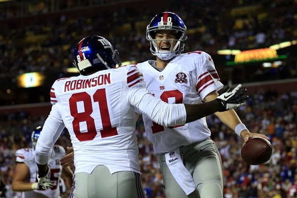 Eli Manning empieza a dominar el nuevo playbook. (AP)